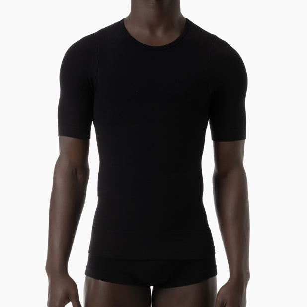 Person wearing a black t-shirt and underwear set on a white background