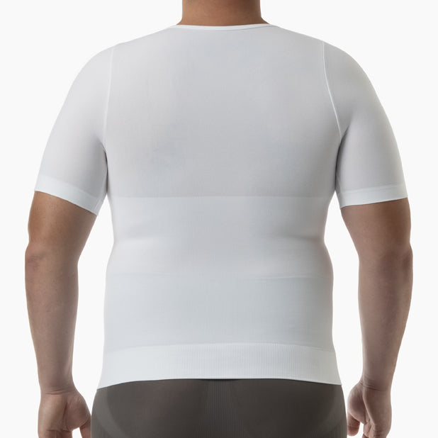 Person wearing a white compression shirt on a plain background