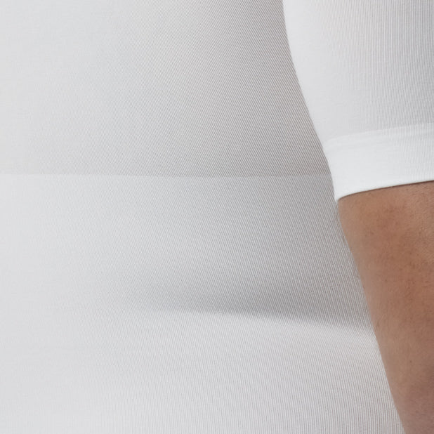 Close-up of a white garment on a light gray background