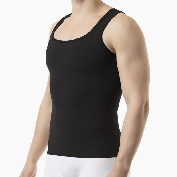 Person wearing a black tank top on a white background