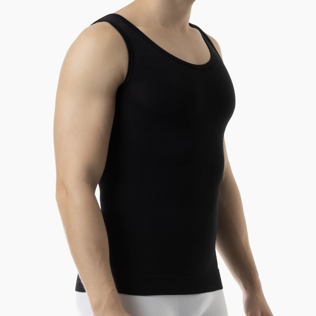 Black tank top worn by a person on a white background