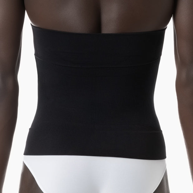Black waist trainer worn by a person on a white background