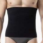 Black waist trainer worn by a person on a white background