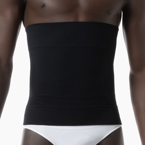 Black waist trainer worn by a person on a white background