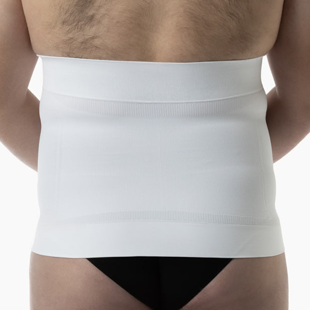 White waist trainer worn by a person on a plain background