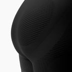 Close-up of a textured black garment on a white background