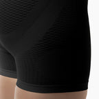Close-up of black athletic shorts with textured pattern on a white background