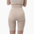 Beige shapewear being worn on a white background