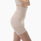 Beige shapewear worn by a person on a white background