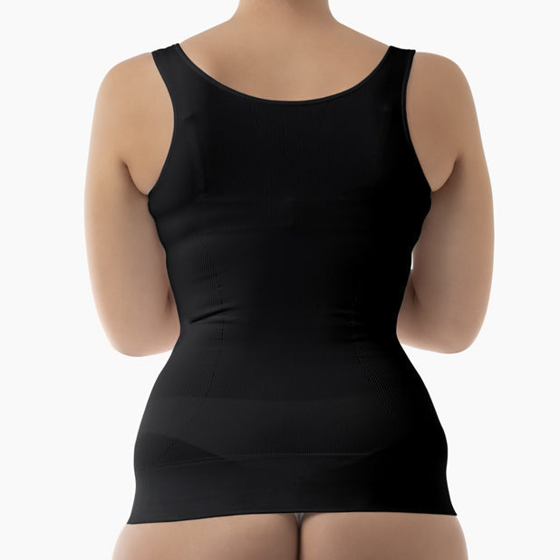 Black shapewear garment worn by a person on a white background