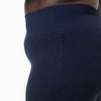 Navy blue compression garment with textured pattern on a white background