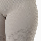 Close-up of beige textured fabric on a white background
