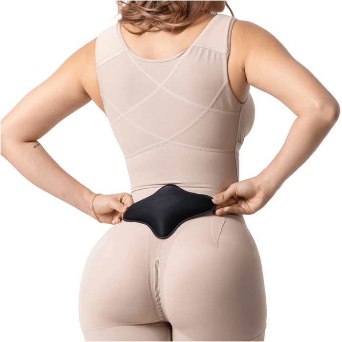 Woman wearing beige shapewear using lumbar compression board for post-surgery support