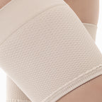 Close-up of a beige textured garment on a neutral background