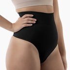 Black shapewear being worn by a person on a white background