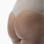 Beige shapewear garment on a white background