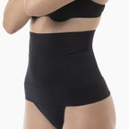 Black waist trainer worn by a person on a white background