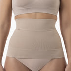 Beige shapewear worn by a person on a plain background