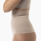 Beige shapewear worn by a person on a white background