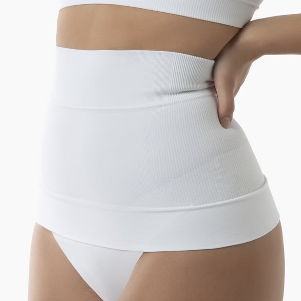White high-waisted underwear worn by a person on a white background