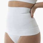 White high-waisted underwear worn by a person on a white background